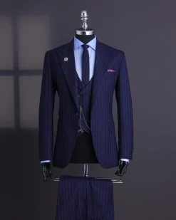 A Navy blue, red pencil stripe, jorgecarli, peak lapel suit.