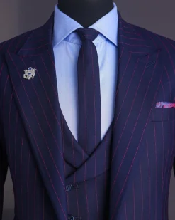 A Navy blue, red pencil stripe, jorgecarli, peak lapel suit.