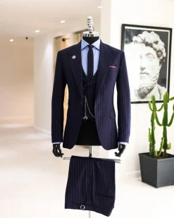 A Navy blue, red pencil stripe, jorgecarli, peak lapel suit.