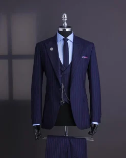 A Navy blue, red pencil stripe, jorgecarli, peak lapel suit.