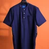 A Navy blue, 120s jorgecarli wool, front flap, short sleeve with clear view Swarovski button details African traditional senator kaftan native.