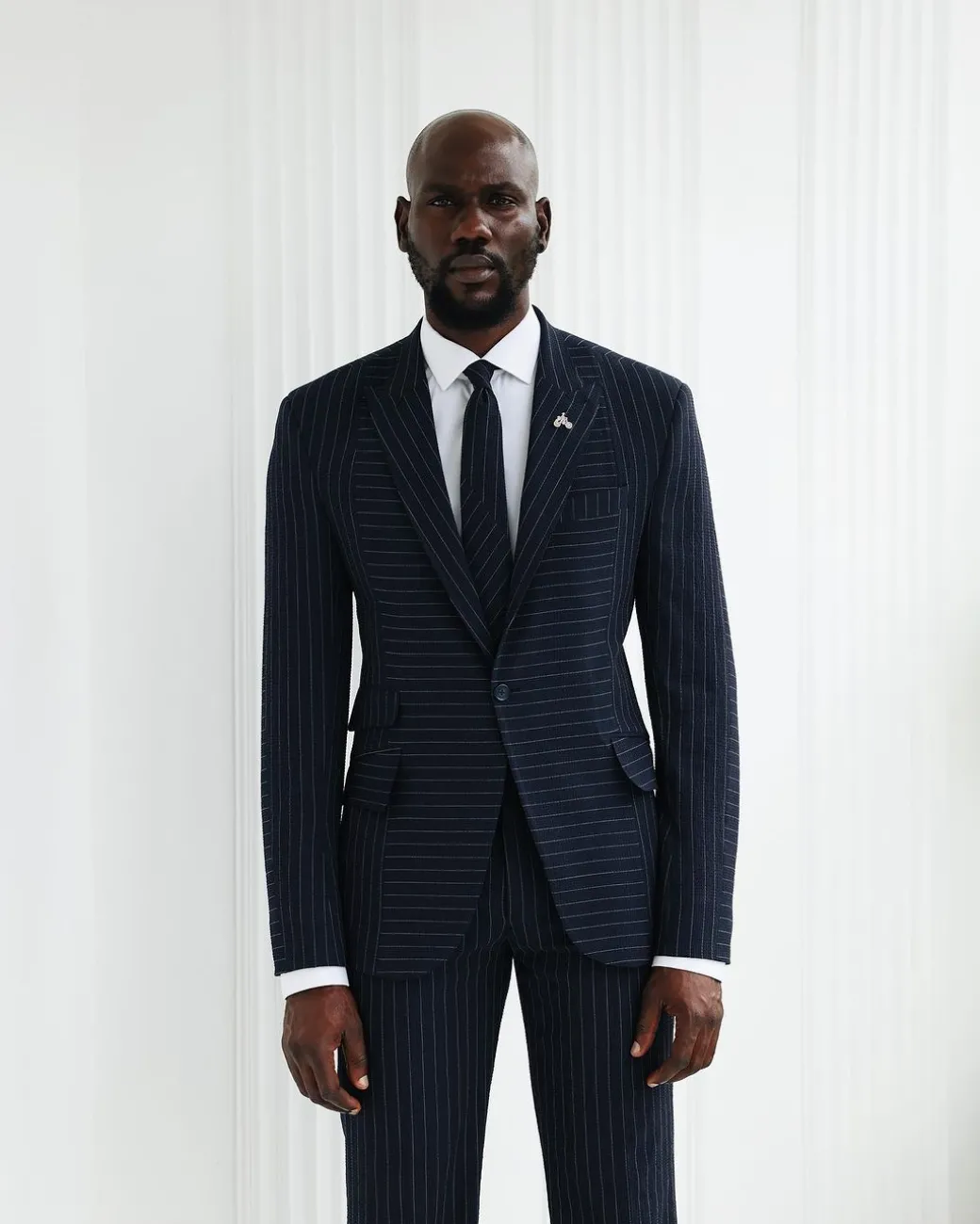 A Navy Blue, Seersucker, Reversed Pin Stripe Peak Lapel Suit