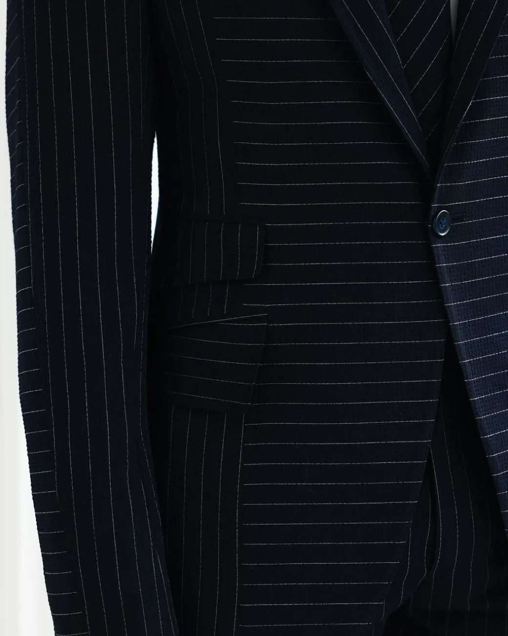 A Navy Blue, Seersucker, Reversed Pin Stripe Peak Lapel Suit