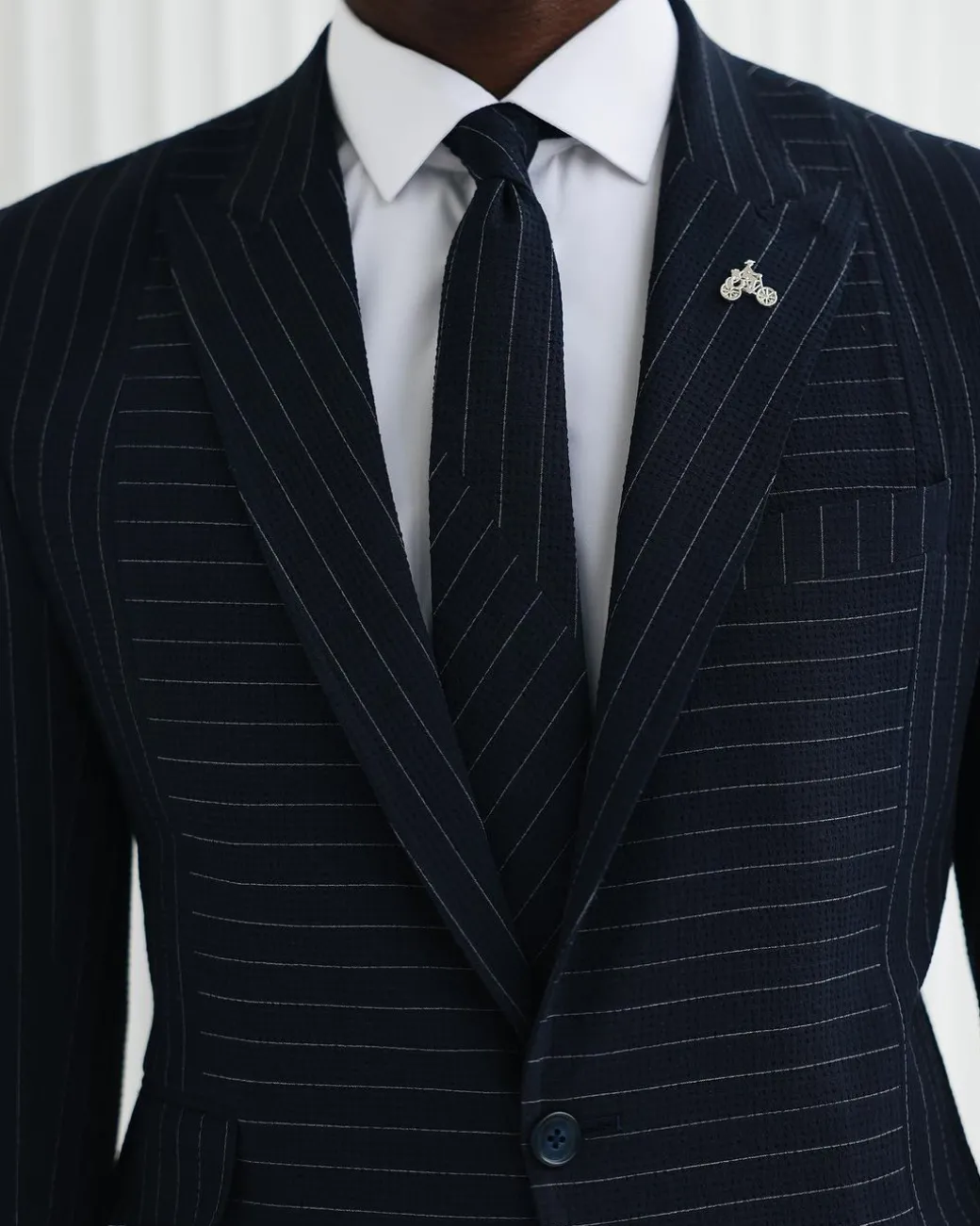 A Navy Blue, Seersucker, Reversed Pin Stripe Peak Lapel Suit