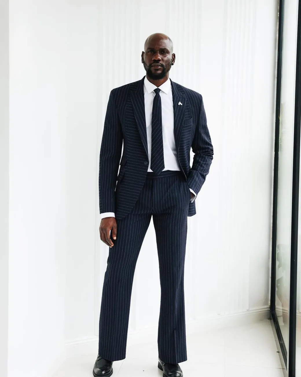 A Navy Blue, Seersucker, Reversed Pin Stripe Peak Lapel Suit