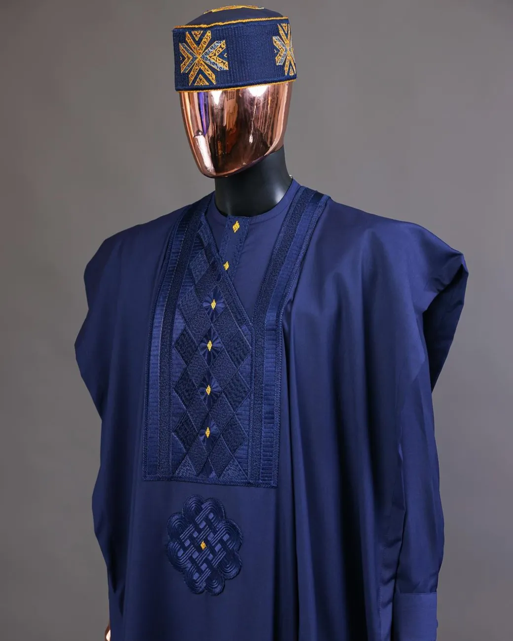 A Navy Blue, Slanting Cube With Dotted Gold Detailing Agbada