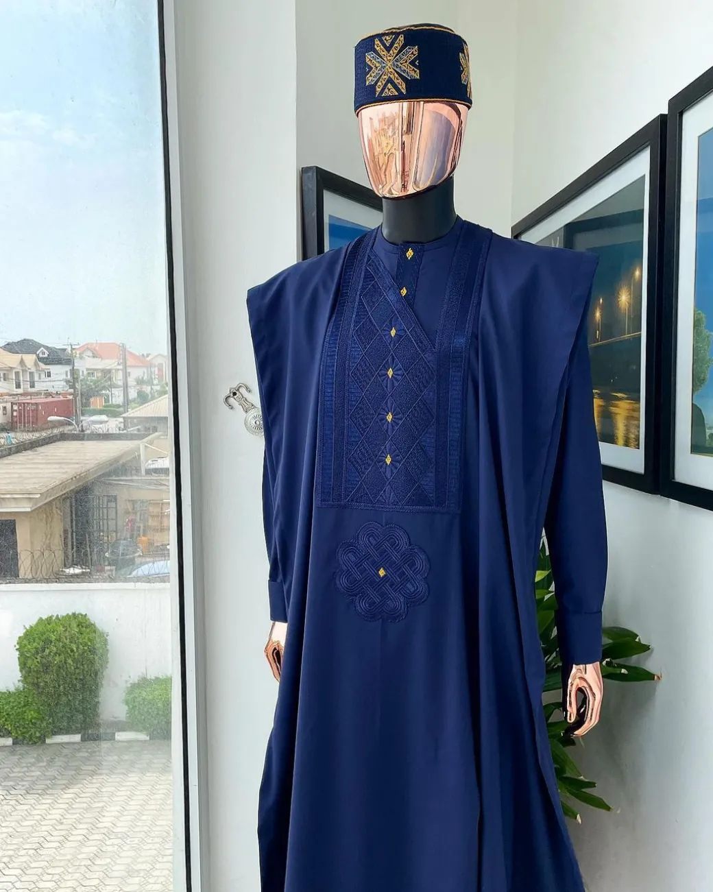 A Navy Blue, Slanting Cube With Dotted Gold Detailing Agbada