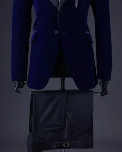 A Navy blue, soaked velvet peak lapel tuxedo suit