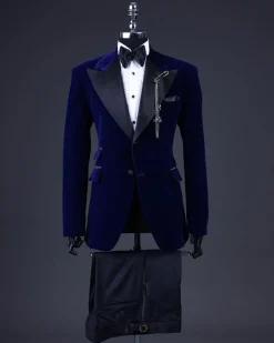 A Navy blue, soaked velvet peak lapel tuxedo suit
