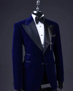 A Navy blue, soaked velvet peak lapel tuxedo suit
