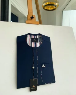 A Navy blue, sport paisley detailing flap and patch pocket and dotted front flap African traditional senator kaftan native.