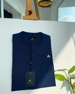 A Navy blue, straight and box connecting lane embroidery detailing african traditional senator kaftan native.