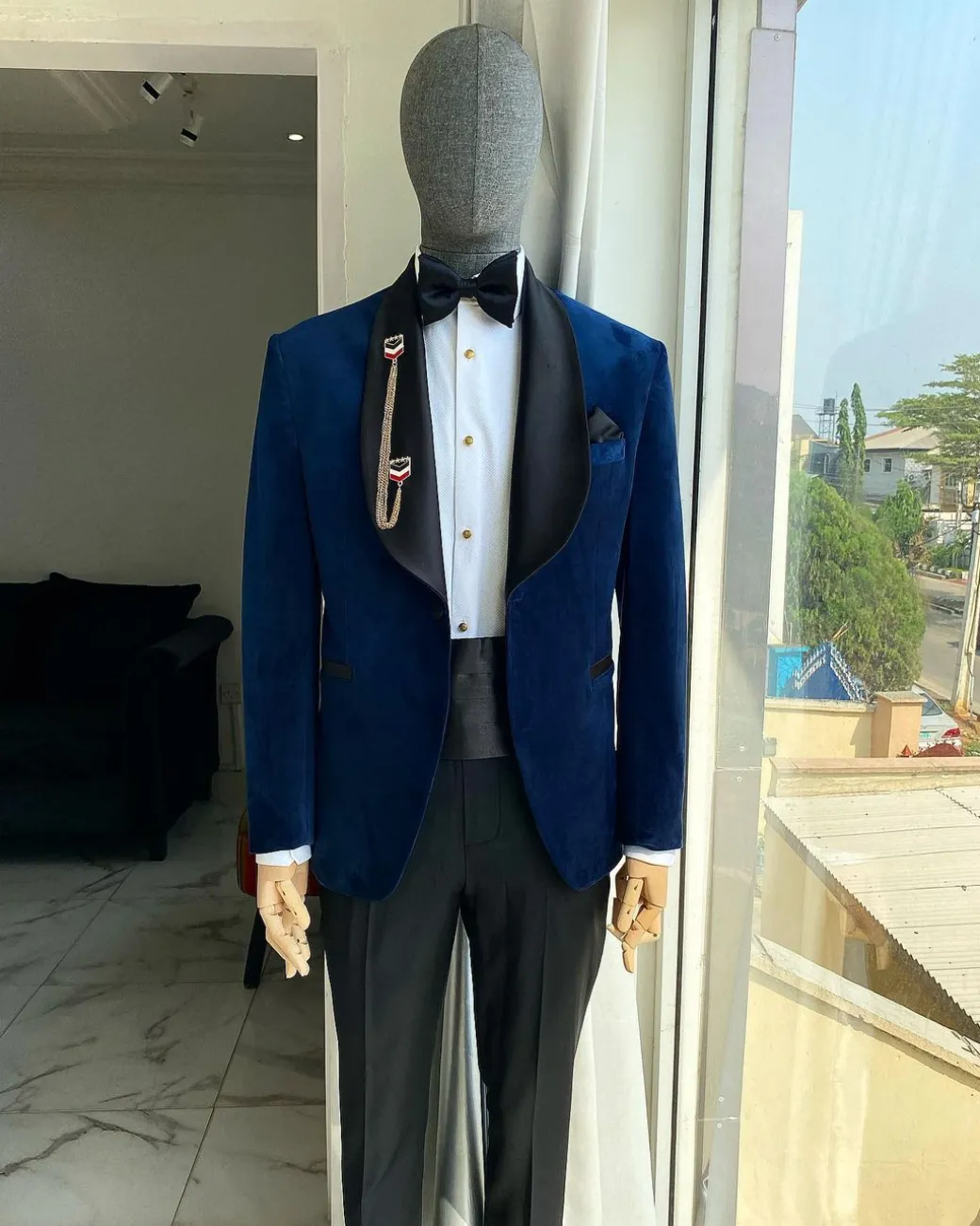 A Navy Blue Velvet Dinner Shawl Lapel Tuxedo Suit.