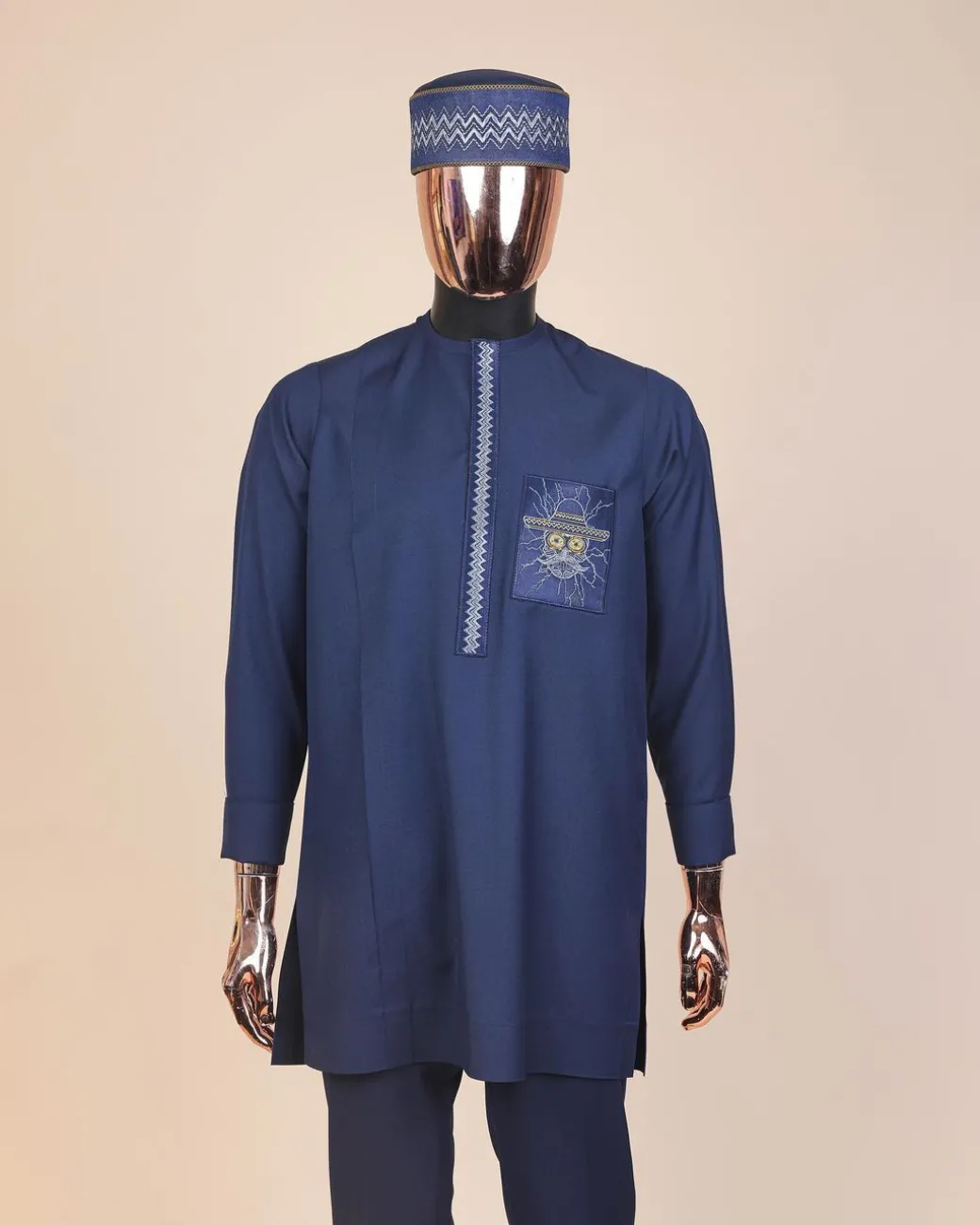 A Navy blue, vexing demagogue pocket and flap embrodery, long sleeve African senator kaftan native.