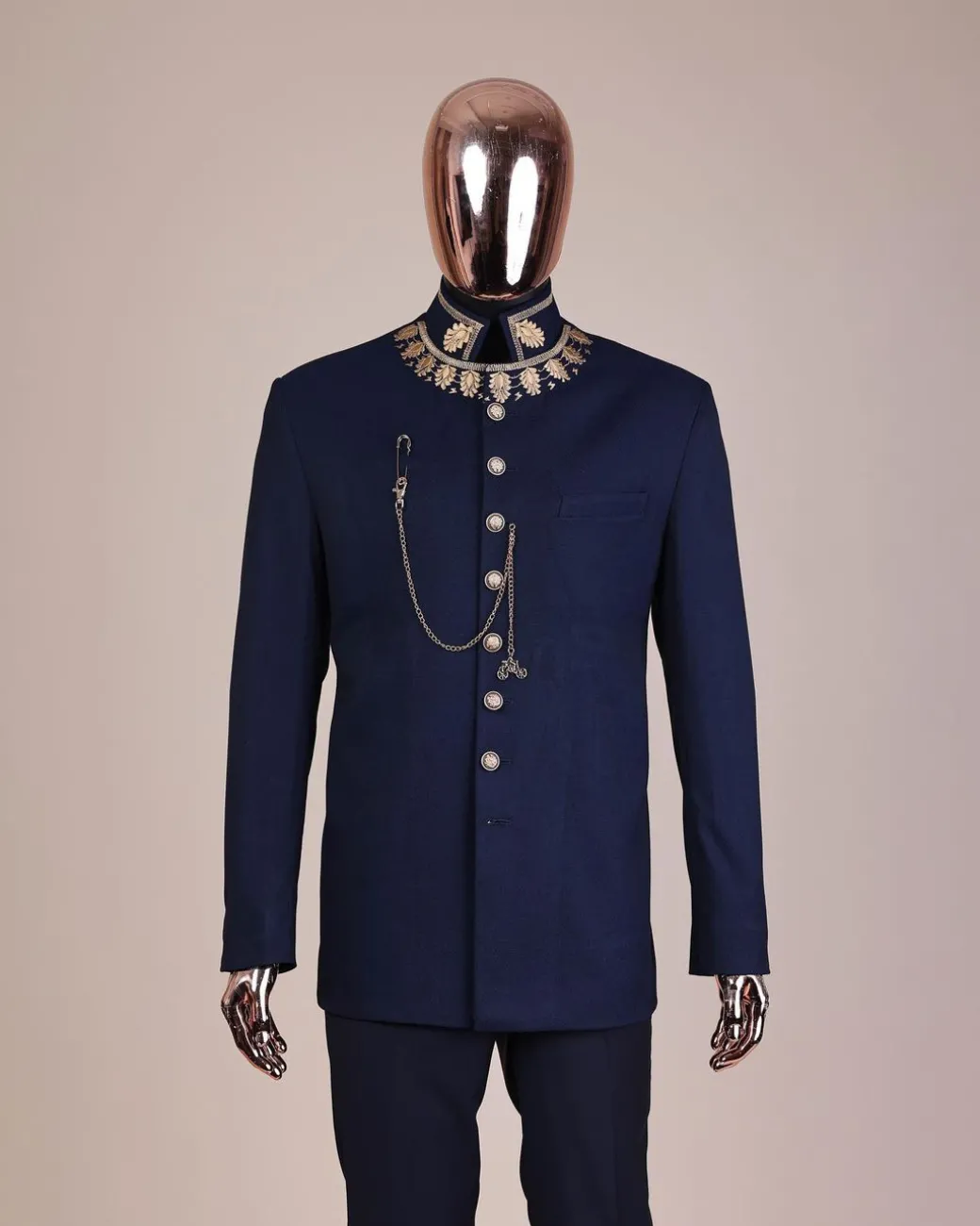 A navy blue, “wakanda” embroidery square patterned metallic jacquard safari suit