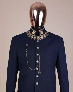 A navy blue, “wakanda” embroidery square patterned metallic jacquard safari suit