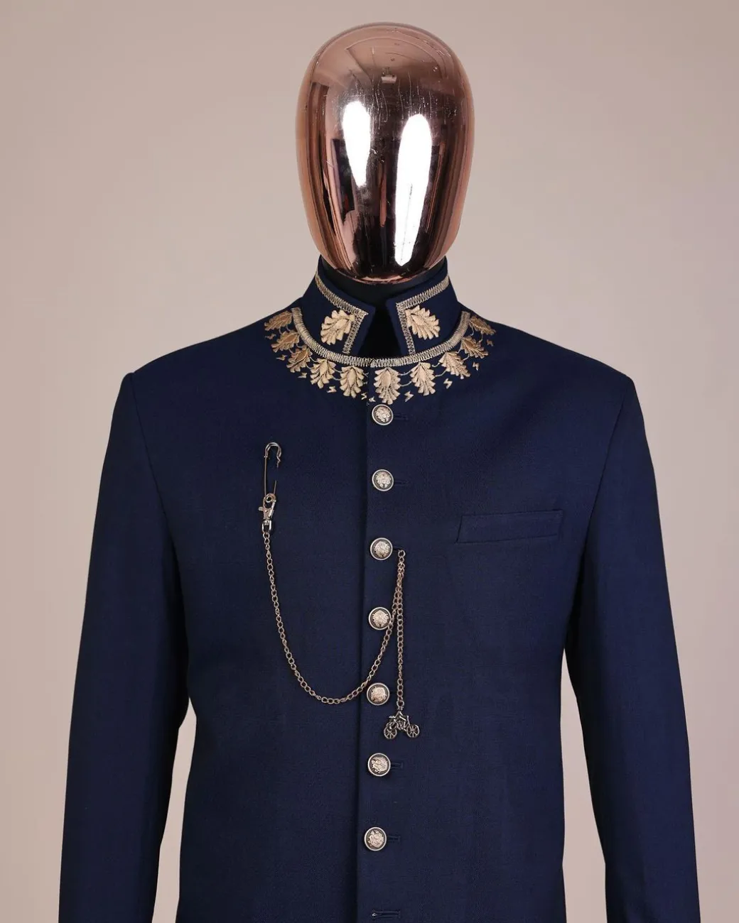 A navy blue, “wakanda” embroidery square patterned metallic jacquard safari suit