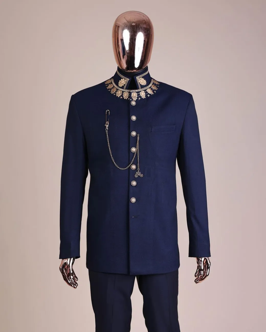 A navy blue, “wakanda” embroidery square patterned metallic jacquard safari suit