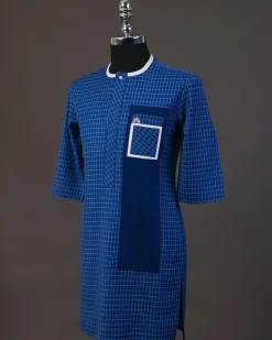 A Neon blue, graph check, front flap with Swarovski button details, and layered pocket traditional senator kaftan native