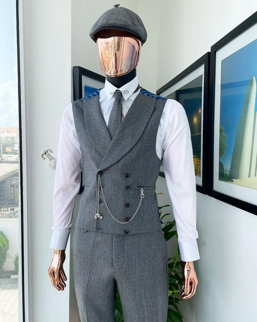 A “peaky blinders” Lava Grey, herringbone-patterned fabric, Jorgecarli Super 140’s “Board Room” notch lapel suit