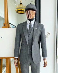 A “peaky blinders” Lava Grey, herringbone-patterned fabric, Jorgecarli Super 140’s “Board Room” notch lapel suit