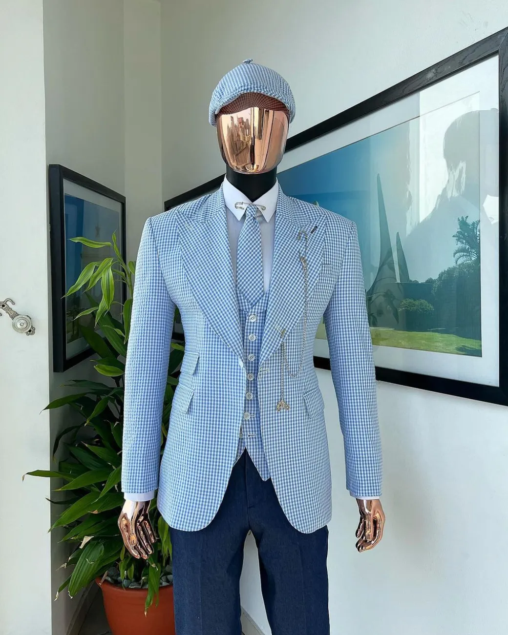 A “peaky blinders” skye blue and white check, seer sucker fabric, knitted, peak lapel suit