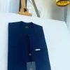 A pencil stripe midnight blue, lanes pocket, lanes front flap African traditional senator kaftan native.