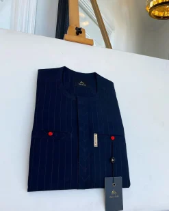 A pencil stripe midnight blue owl eye, double pocket, front flap African traditional senator kaftan native.