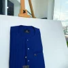 A pencil stripe, navy blue and Skye blue, front flap, blue and clear view Swarovski buttons, patch pocket detailing senator kaftan native.