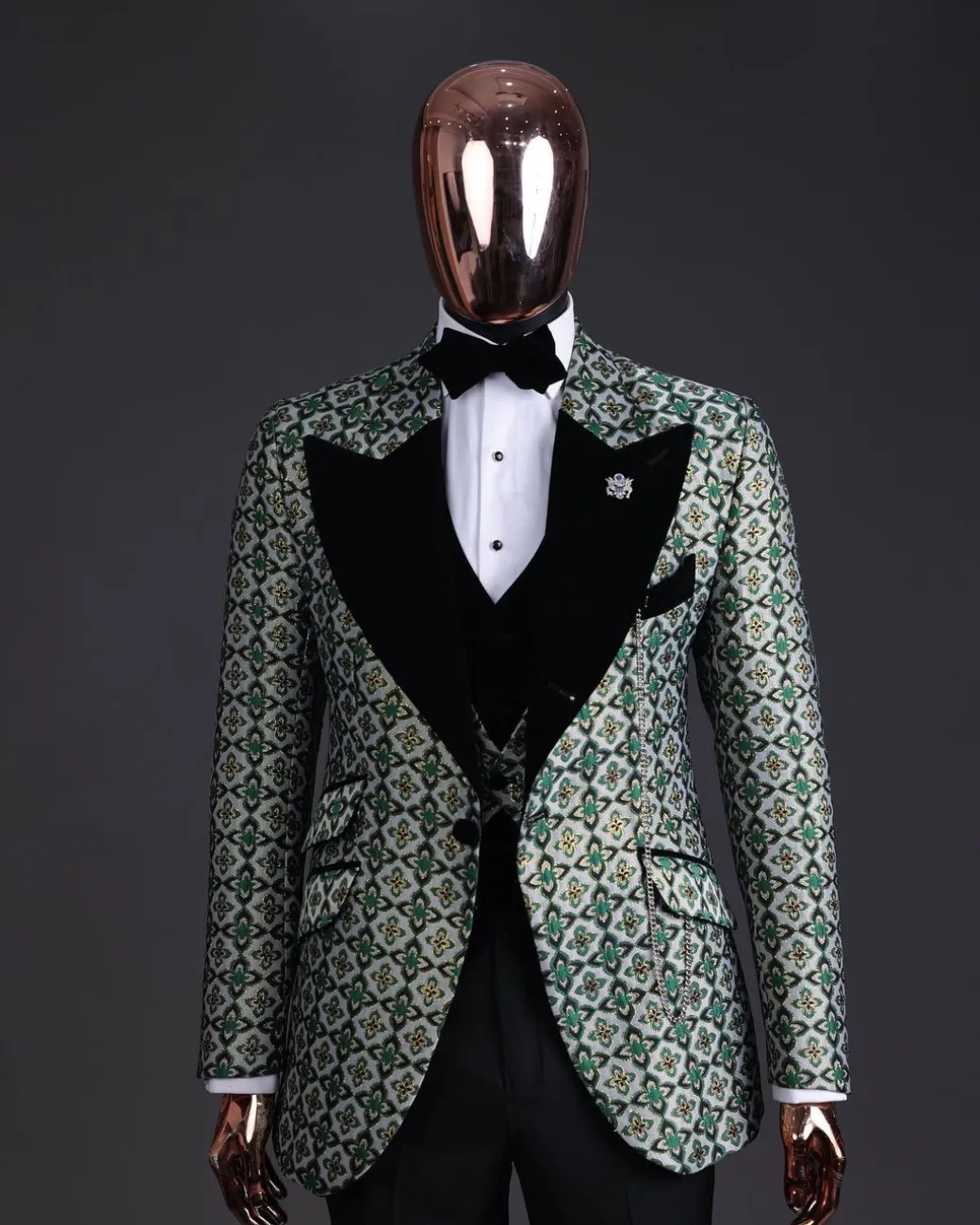A Pine, pistachio green and black mix metallic jacquard, peak lapel tuxedo suit