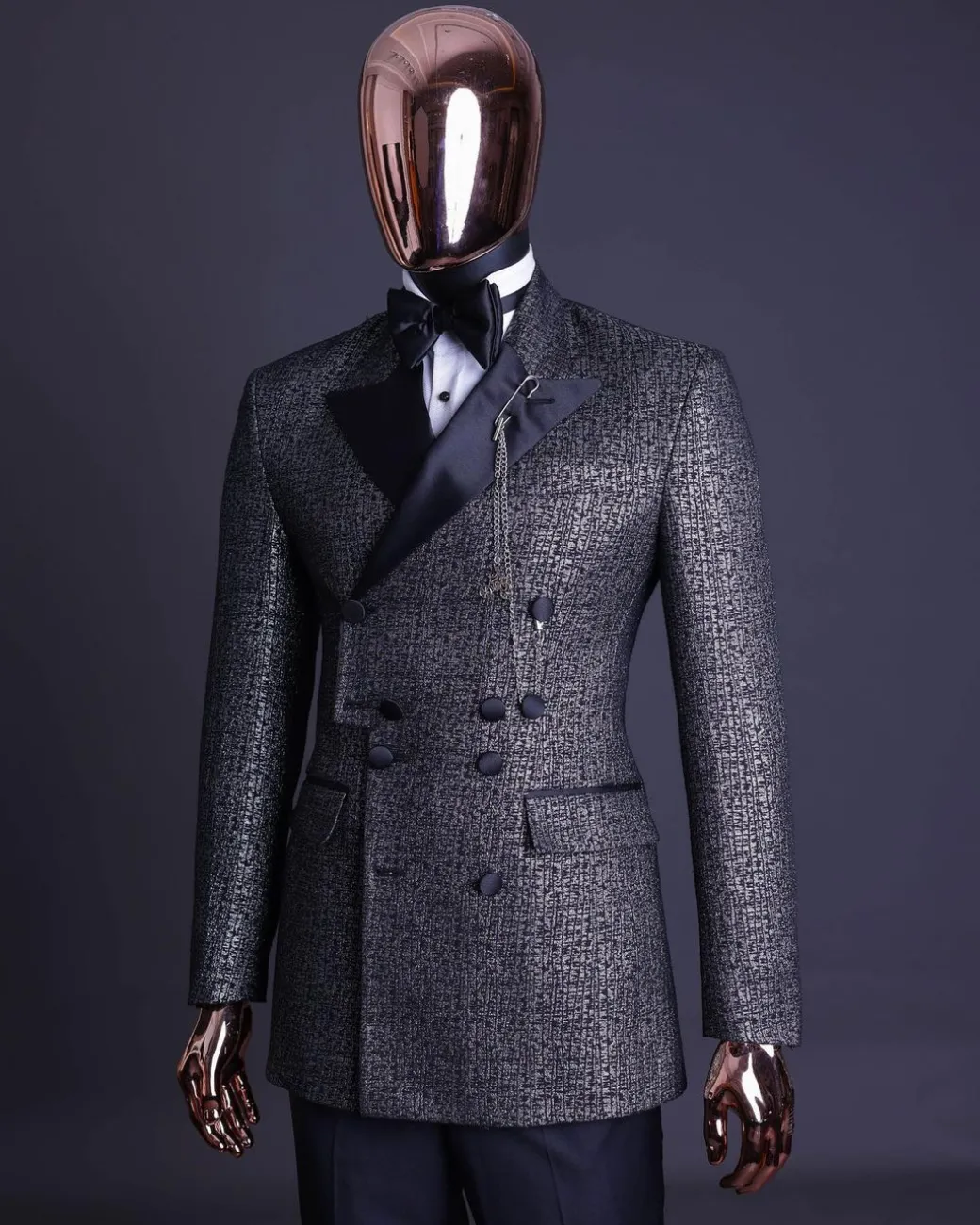 A “pirate” metallic jacquard, layered double breasted, 10 buttons, peak lapel tuxedo suit