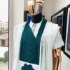 A pistachio green, connected inverted square ping green embroidery design agbada
