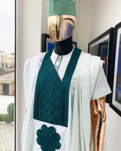A pistachio green, connected inverted square ping green embroidery design agbada