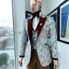 A pistachio green, pink and brown floral metallic jacquard tuxedo suit