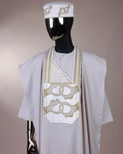 A porcelain, connected medulla and wooven pattern embroidery detailing agbada