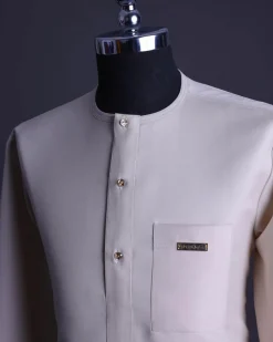 A Porcelain, front flap with gold Swarovski button, patch pocket, 3/4 sleeve African senator kaftan native.