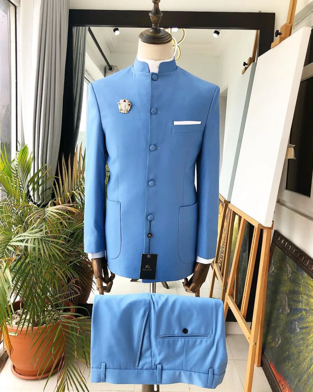 A Powdered Blue “clergyman” French safari Suit