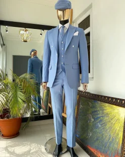 A powdered blue ”peaky blinders” peak lapel business suit