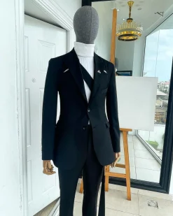 A “power” front and back slit charcoal black, long cross strap peak lapel suit