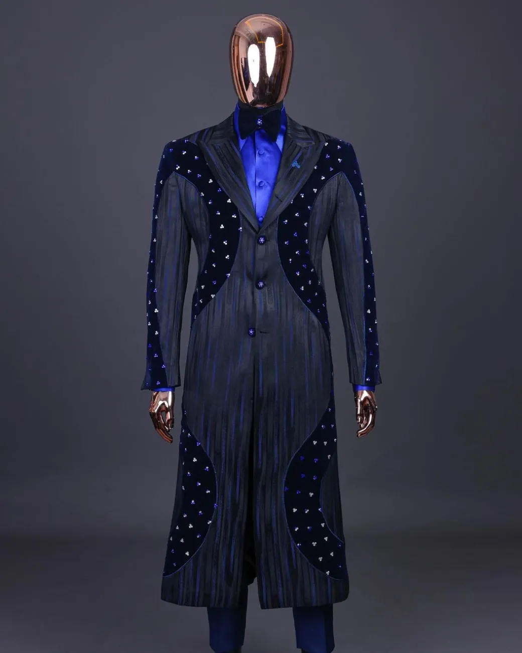 A “Prodigal” lashed midnight blue, admiral blue and splashed black metallic jacquard trench suit