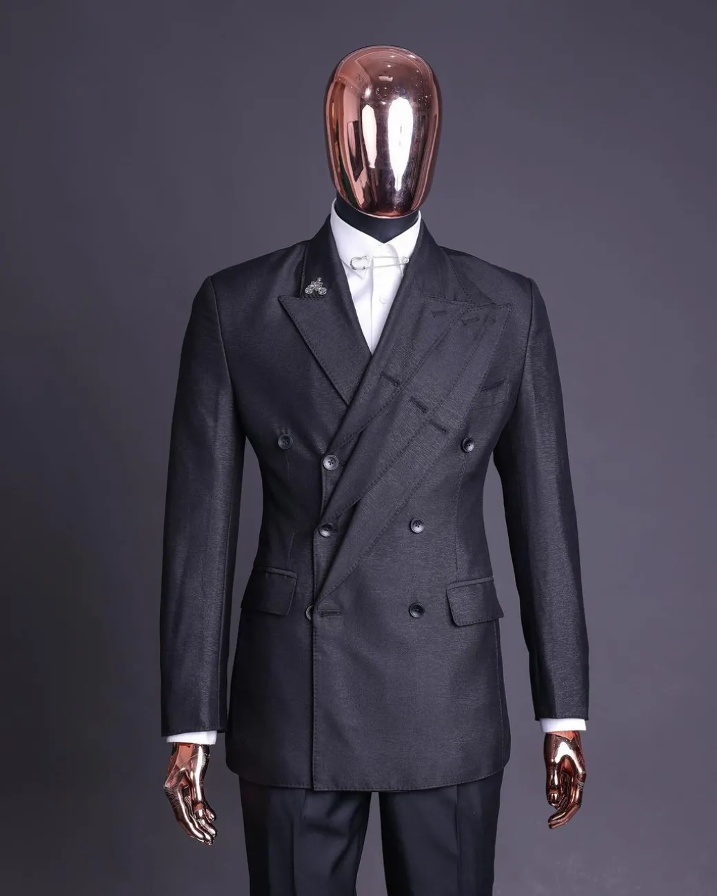 A “quad” charcoal black, 8 button, knitted,Peak lapel “4” breasted suit