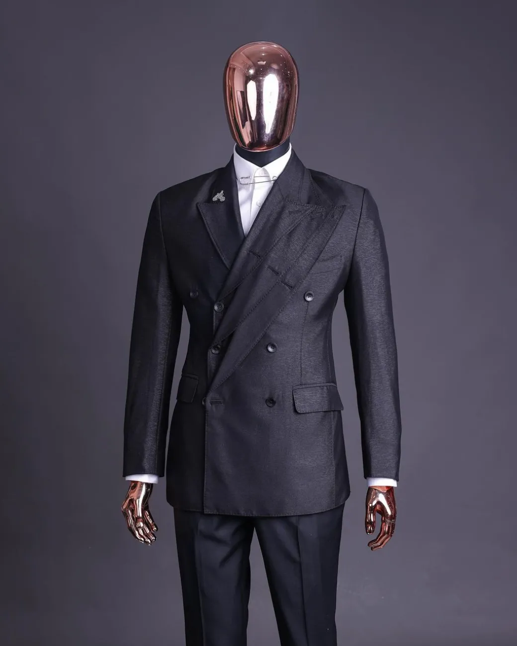 A “quad” charcoal black, 8 button, knitted,Peak lapel “4” breasted suit