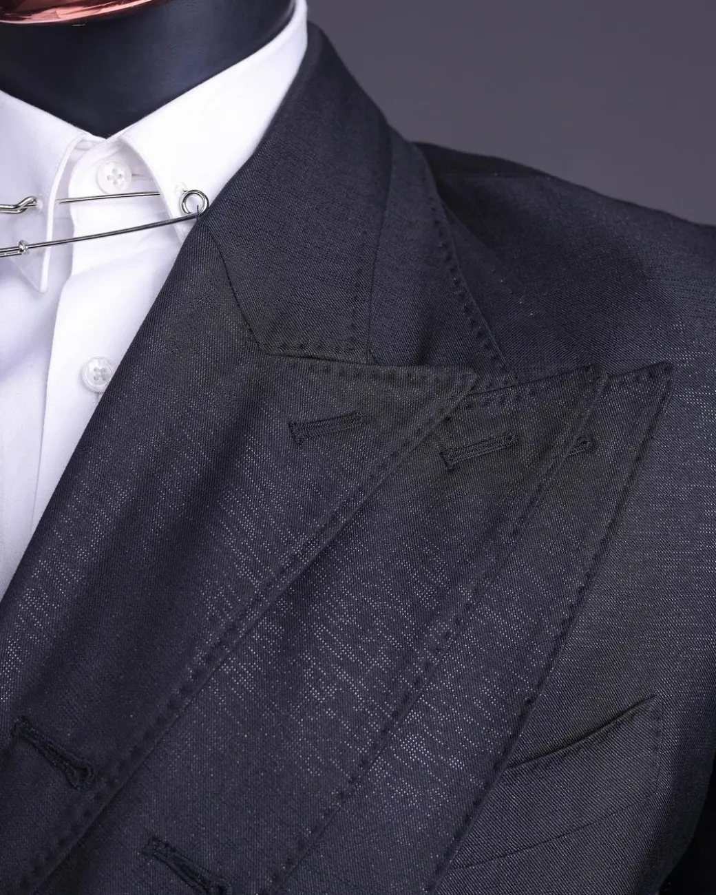 A “quad” charcoal black, 8 button, knitted,Peak lapel “4” breasted suit