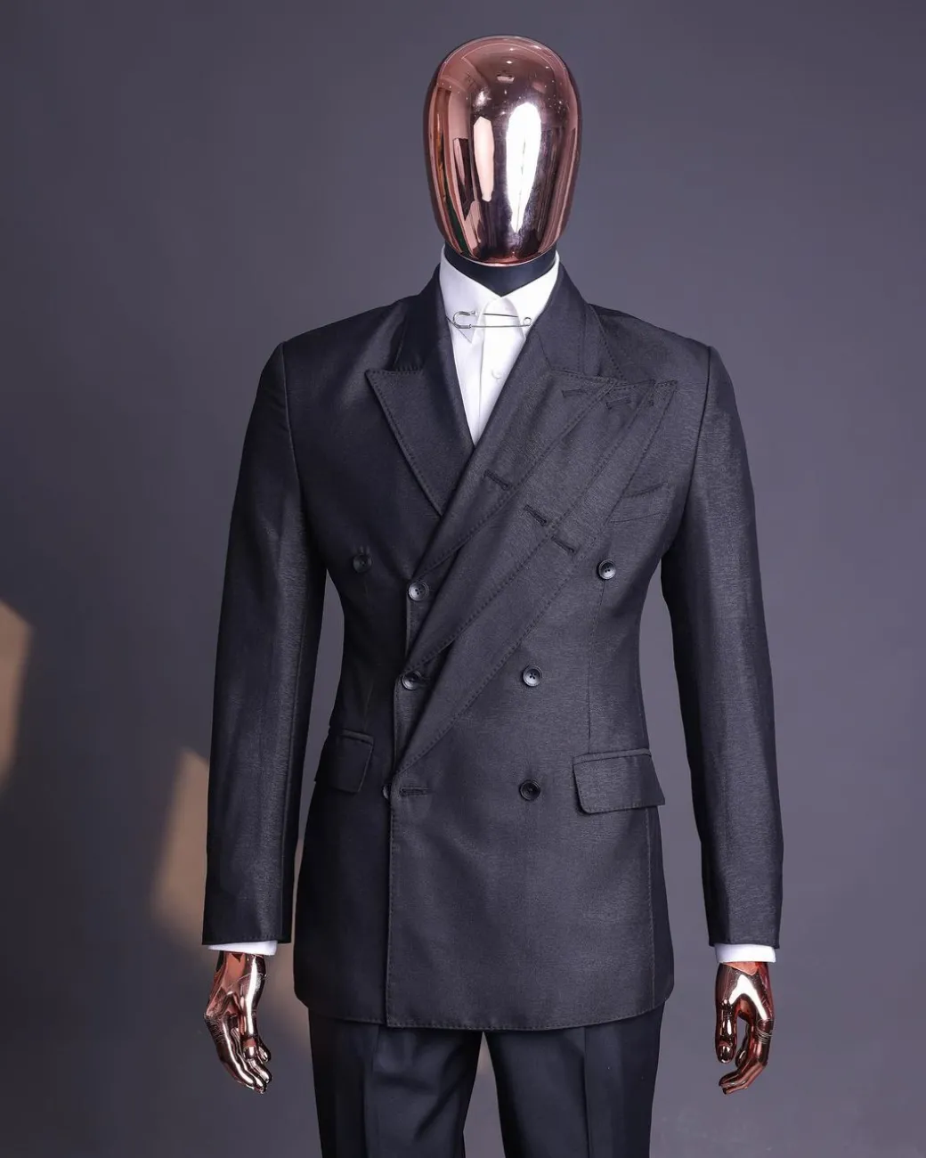 A “quad” charcoal black, 8 button, knitted,Peak lapel “4” breasted suit