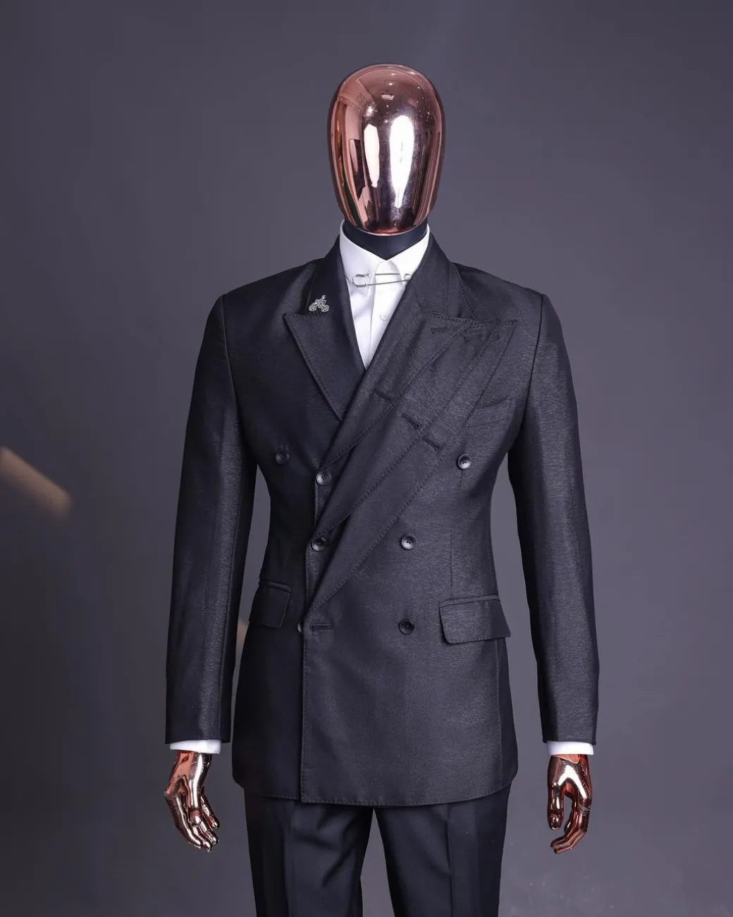 A “quad” charcoal black, 8 button, knitted,Peak lapel “4” breasted suit