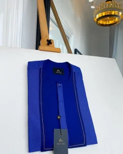 A related shade of blue rectangular front flap with clear view Swarovski button senator kaftan native