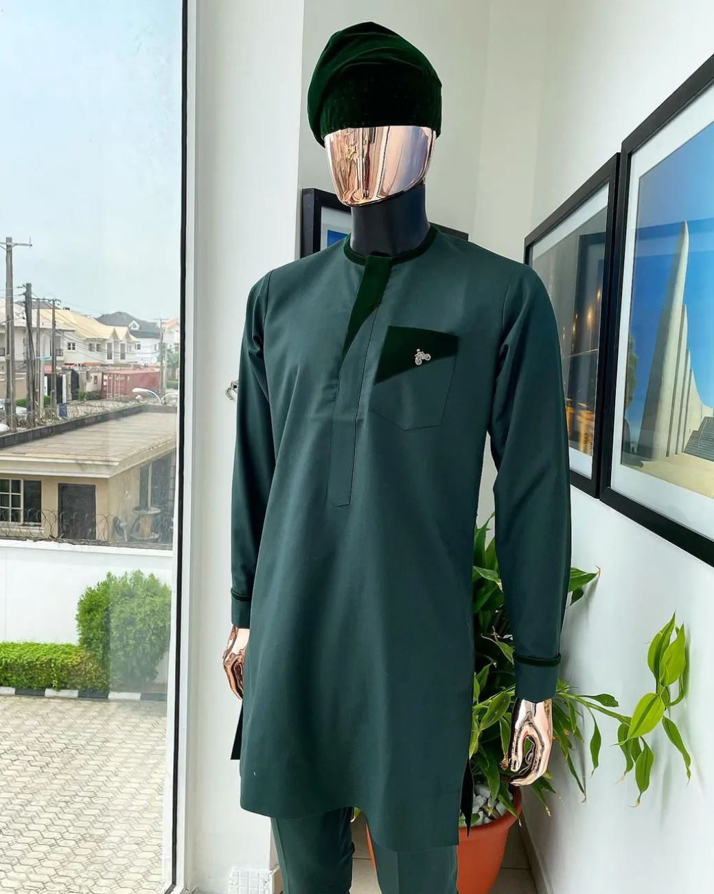 A reloaded British racing green, Monochrome embroidery with soaked Italian velvet detailing long sleeve Kaftan and sokoto