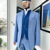 A reloaded ceremonial “Ayeye” Ijade 20/21 – Look 5- “Tokunbo” look. Powder blue half section back slant cut jacket