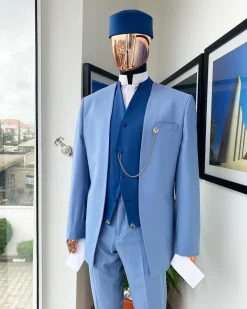 A reloaded ceremonial “Ayeye” Ijade 20/21 – Look 5- “Tokunbo” look. Powder blue half section back slant cut jacket