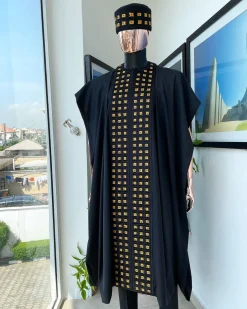 A Reloaded charcoal black, connected square embroidery design with matching gold and red Swarovski stone details agbada